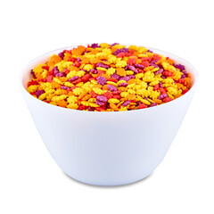Colorful candies in white bowl isolated on white background, copy space. Cake decor