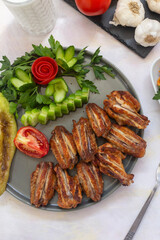 Chicken wings on the grill. Grilled chicken wings on a white background