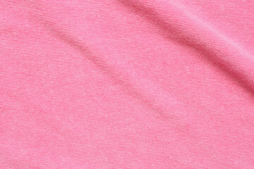 Fototapeta na wymiar Pink towel fabric texture surface close up background
