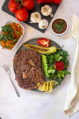 beef steak - cooked ribeye on a white background. grill beef steak. top wiev