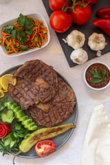 beef steak - cooked ribeye on a white background. grill beef steak. top wiev