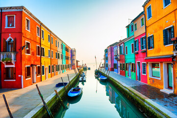 Colorful houses on the canal in Burano island, Venice, Italy. Famous travel destination.