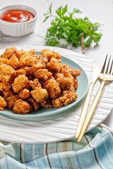 Popcorn chicken - american fast food on a plate