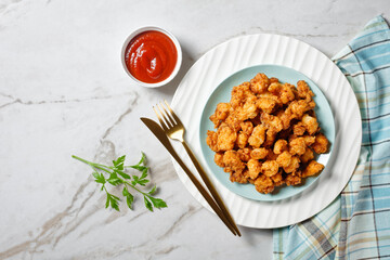 Popcorn chicken - american fast food on a plate