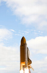 Rocket spaceship. Blue skies. The elements of this image furnished by NASA.