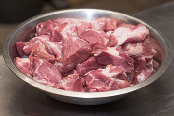 A bowl filled with fresh pork meat.