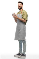 people, profession and job concept - happy smiling waiter in apron taking notes to notepad over white background