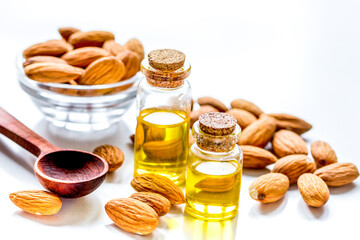 cosmetic set with almond oil on table background
