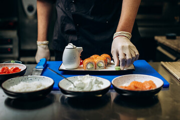 Obraz na płótnie Canvas Cooking sushi in a japanese restaurant