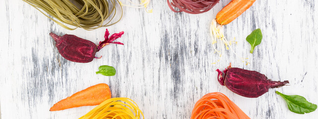 Banner of Colored Raw Vegetable Vegetarian Pasta.