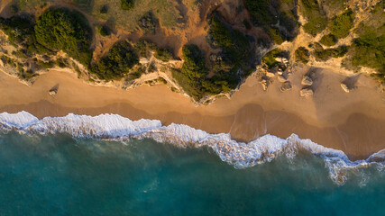 Aerial top view of a paradise beach in a magical afternoon in Caños de Meca, Andalusia, Spain
