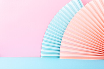 Colorful abstract background with paper fans, multicolored, light blue and pink. Trend Concept with copy space. For products presentation or exhibitions