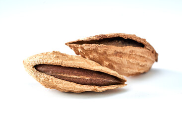 Almonds are the kernel of the nut was lying on a white background.Space for text