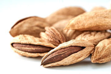 Almonds are the kernel of the nut was lying on a white background.Space for text