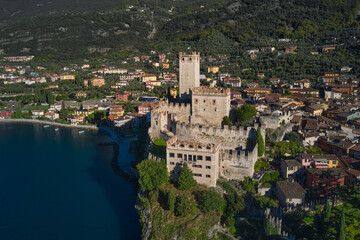 Fototapeta na wymiar Panoramic aerial view of Scaliger Castle in Malcesine, Malcesine town. Italian resort on Lake Garda, Monte Baldo. Malcesine town, Lake Garda, Italy.