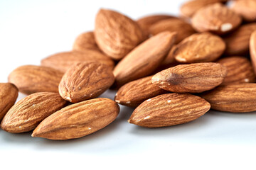 Almonds are the kernel of the nut was lying on a white background.Space for text