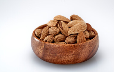 Almonds are the kernel of the nut was lying on a white background.Space for text