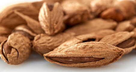 Almonds are the kernel of the nut was lying on a white background.Space for text