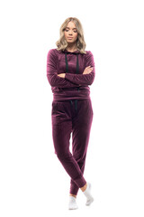 Fototapeta premium Relaxed calm beautiful confident young woman in home wear burgundy sweatsuit looking down. Full body length isolated on white background. 