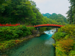 Naklejka premium Traditional Japanese bridge over a clear stream (Tochigi, Japan)