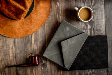 Writer workplace with tools on wooden background top view