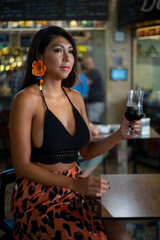 Young lady with a cup of wine