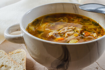 Cabbage soup with fresh cabbage. Russian kitchen. A plate of hot soup close up. Dinner. Healthy and satisfying food.