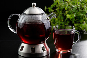Teapot and tea mug in an elegant  studio shot.