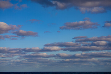 Naklejka na ściany i meble Beautiful sky over the beach ocean horizon