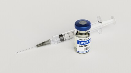 Eine Corona Impfdosis in einem Fläschen steht neben einer Spritze auf weißem Untergrund