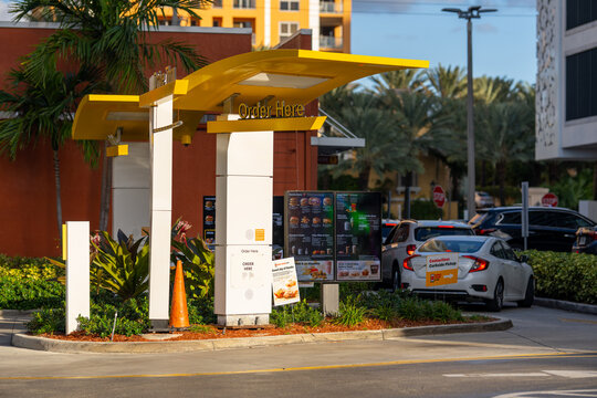 Miami, FL, USA - December 2, 2020: Mcdonalds Drive through two lanes with menu display