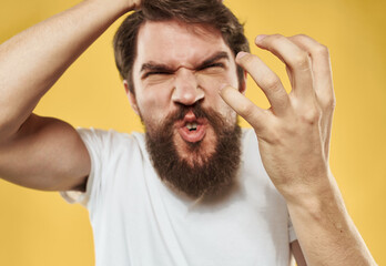 Obraz premium Angry man in white T-shirt mental deviation thick beard model