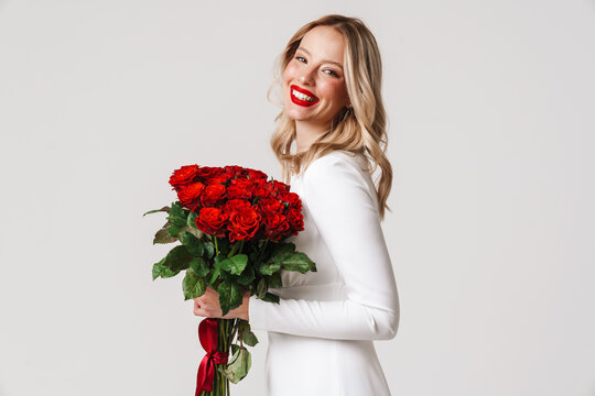 Woman In White Dress Holding Red Roses