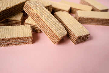 Chocolate waffles on a pink background