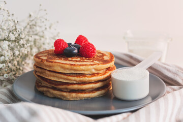 Collagen powder recipes concept. Pancakes made with collagen or protein  powder. Perfect tasty and healthy breakfast. Beauty supplements for skin and bones.