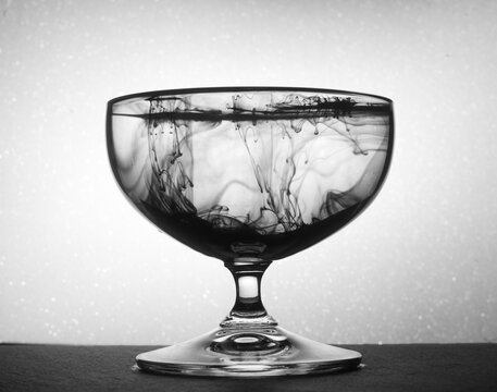 Glass with drink on background with bokeh