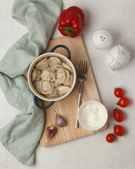 Prepared semi-finished products. Dumplings, khinkali, manti. New year's atmosphere