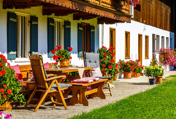Fototapeta na wymiar typical bavarian frontyard at a farmhouse near the alps