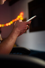 Male hands holding cellphone