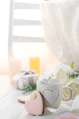 Valentine's day romantic breakfast wuth gingerbread Heart with icing and cup of coffe