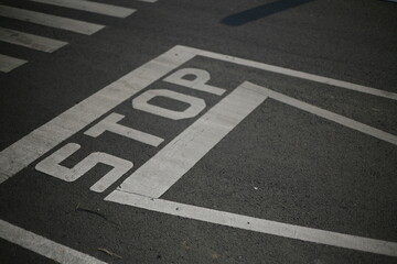 stop sign on asphalt at three-way junction road