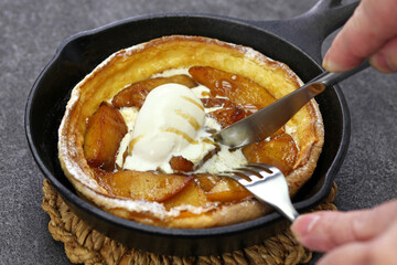 homemade apple dutch baby pancake with icecream, christmas breakfast
