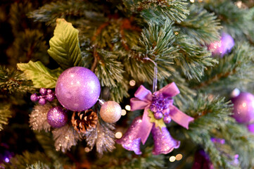 Closeup of Christmas Ball on Christmas Tree with bokeh beautiful background for design and decoration, new year concept, selective focus.