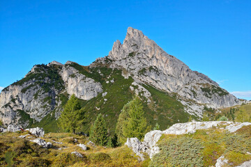 View of the beautiful Dolomites mountains in Italy against the background of blue sky.