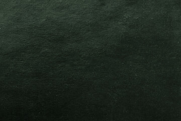 Abstract background made of rough craft paper. Blank surface for a design dark green color