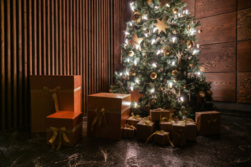 Shining christmas tree in the dark room