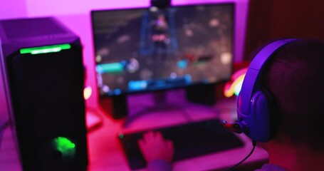 Young streamer gamer playing at strategy game in broadcast browser - Male guy having fun gaming and streaming online - New technology game trends and entertainment concept