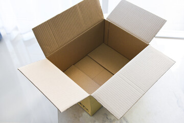 Open cardboard box on floor background, High angle view of an empty cardboard box or Parcel box.