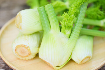 Fennel vegetable from the garden , Fresh raw fennel bulbs ready to cook on food wooden nature green background.