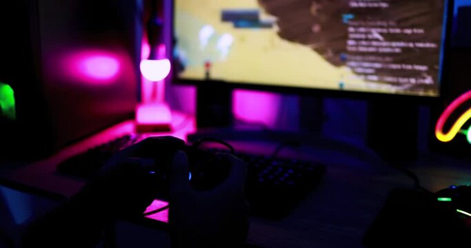 Gamer playing at computer game using joypad - Young man streaming online while gaming on internet tournament - Technology, e sports and entertainment concept